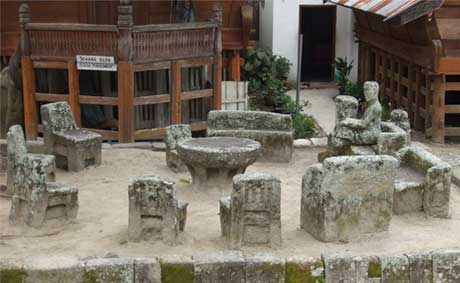 Stone chairs form ancient court yard at Huta Siallagan, Ambarita, Lake Toba